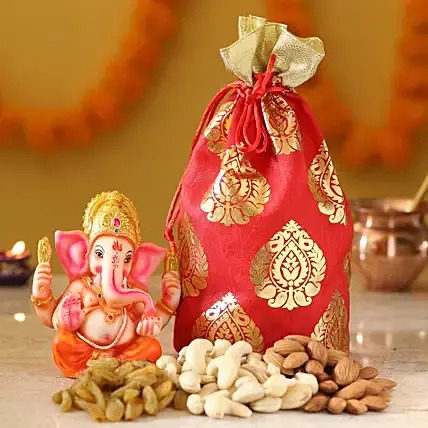 Lord Ganesh Idol and Dry Fruits
