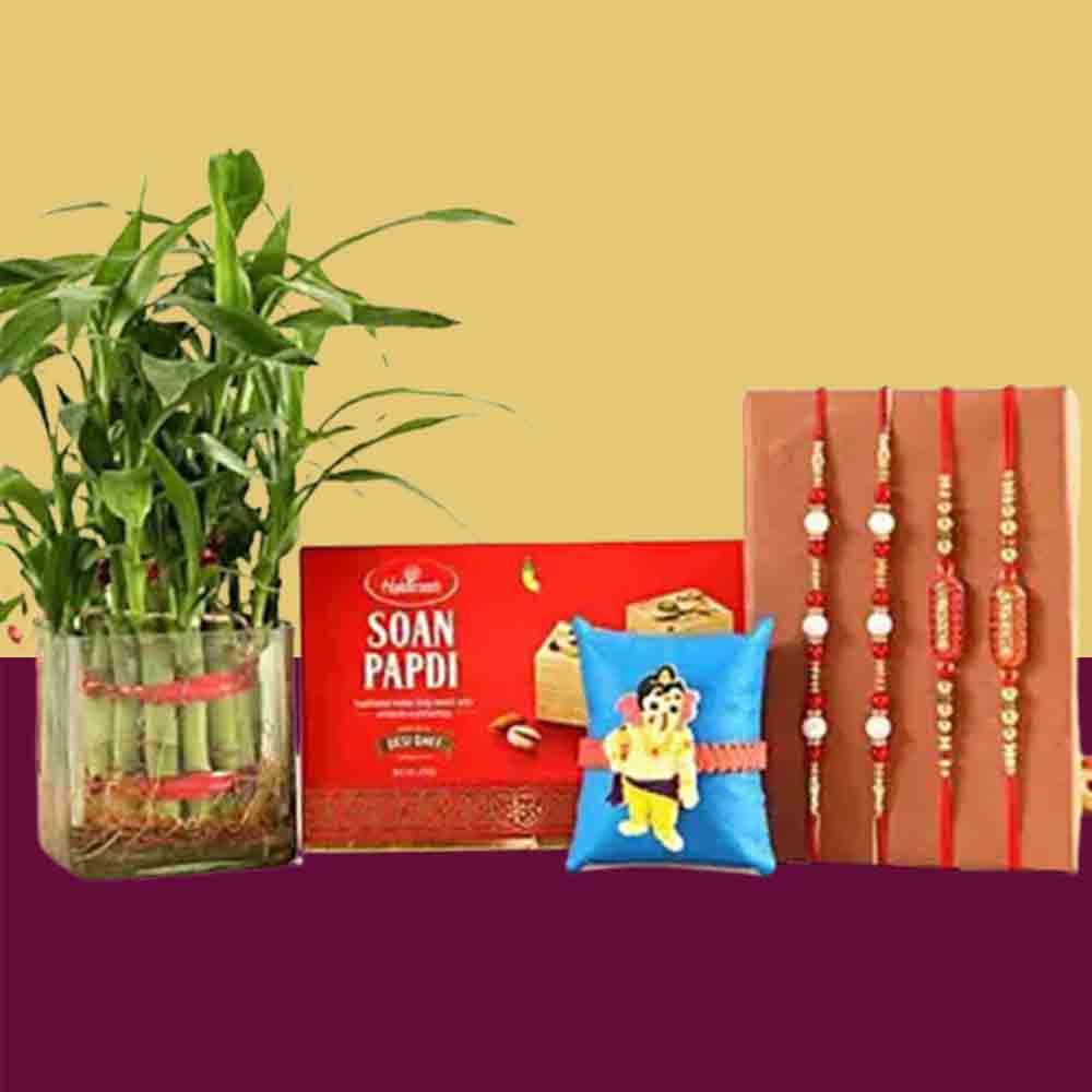 4 Rakhis With Soan Papdi and Combo of Bamboo