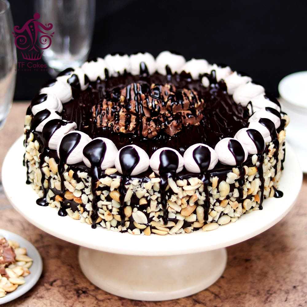 Chocolate Overloaded Snickers Cake