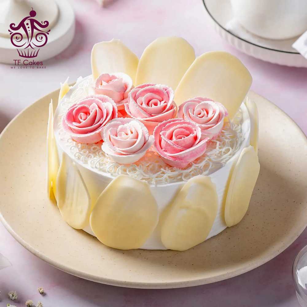 Gorgeously White forest Cake with  Pink Roses on Top
